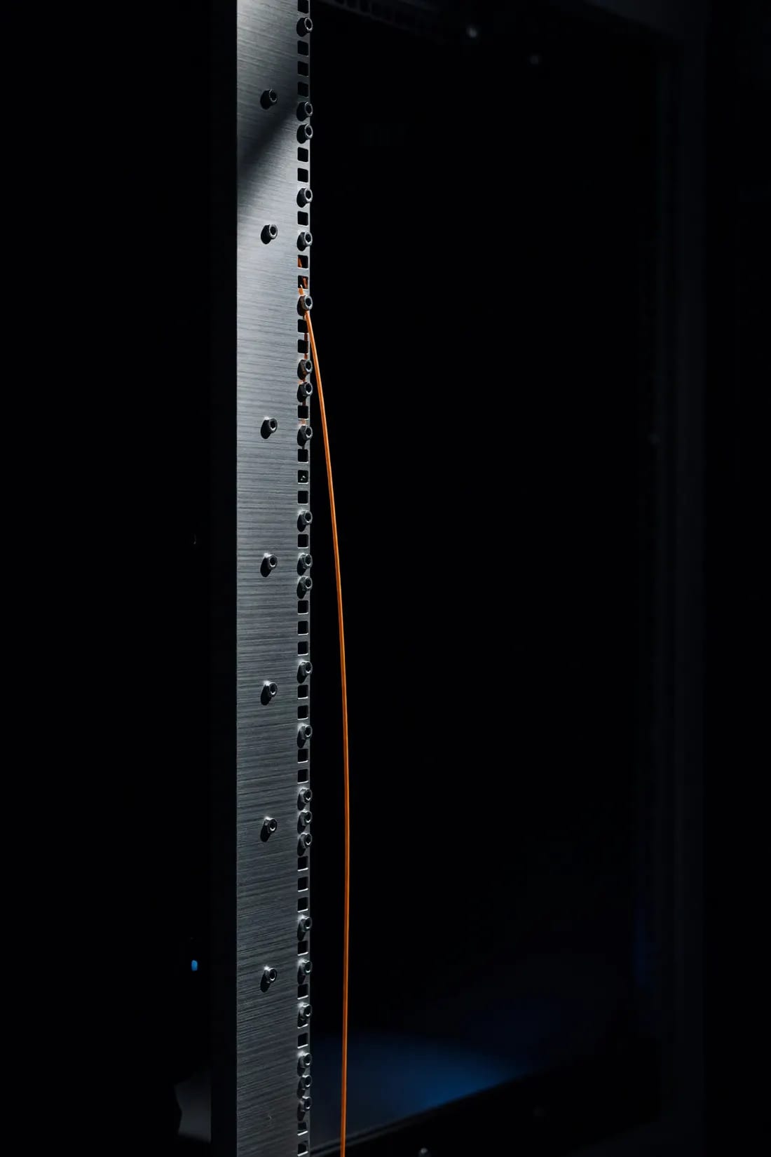 A machined aluminium rack upright with a single fibre run